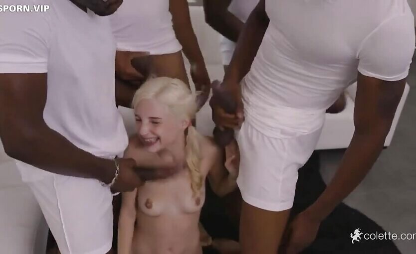 Young And Adorable Blonde Surrounded By Black Men