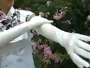 Asian Girl Gives A Nice Handjob While Wearing Satin Gloves